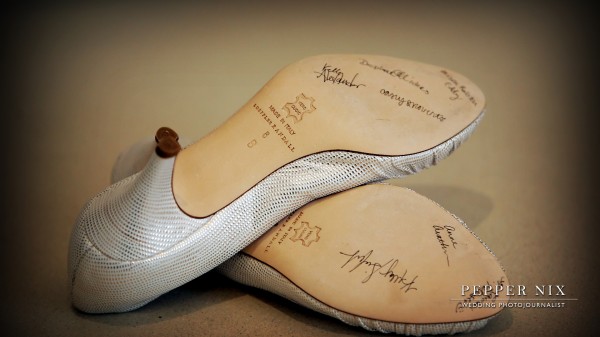 Each of the bridesmaids signed the bottom of the bride's shoes.  Tradition says, the name that stays on the shoe the longest will be the next girl to be married!